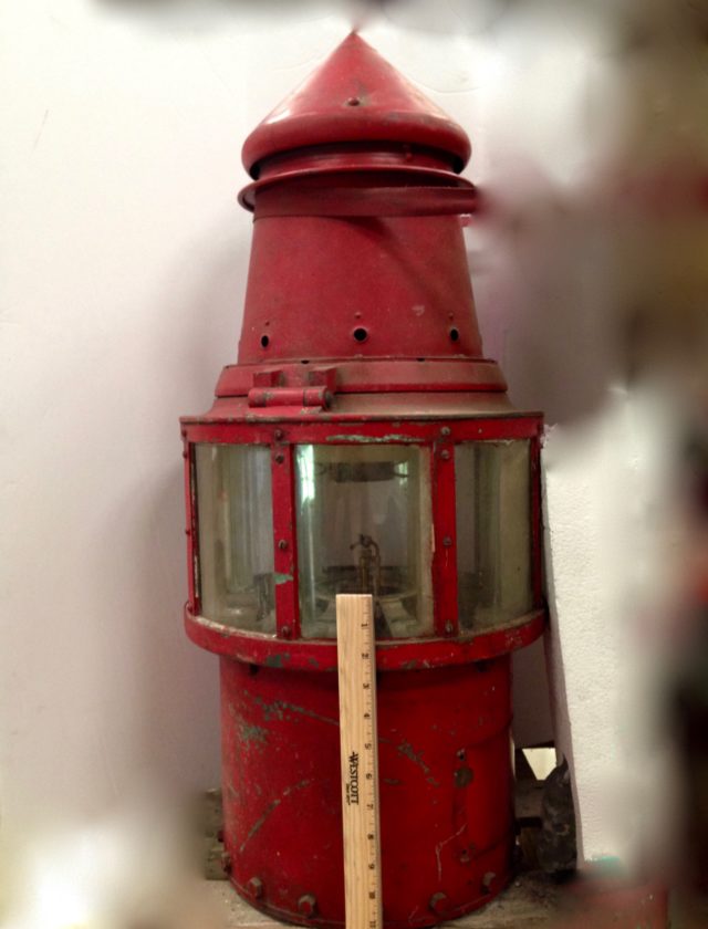 Large red painted brass and copper nautical lantern Gas Accumulator CO (UK) Ltd. masthead or buoy lantern having brass cylindrical base with clear glass lens with copper mushroom formed top, base having maker's plaque marked Gas Accumulator